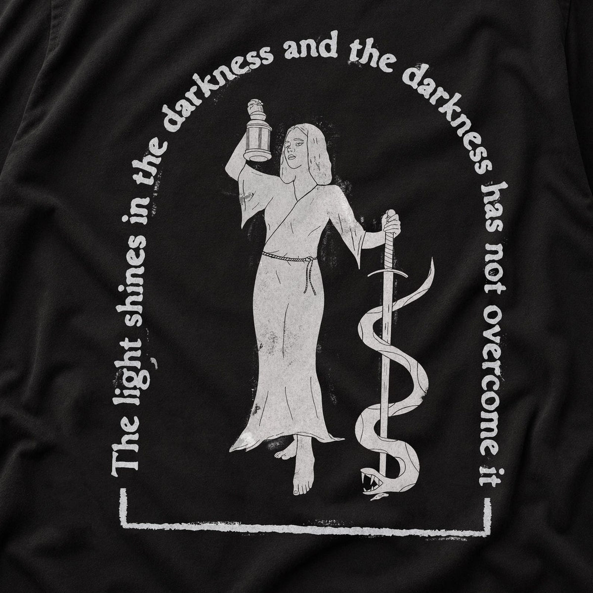 The Light Shines in the Darkness Tee